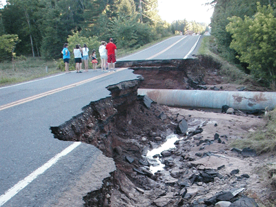 Washed out culvert and road Washed out culvert and road