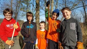 Cub scouts clearing weed