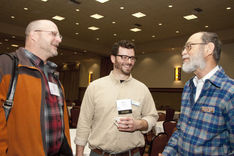 Attendees at the Wetland Science Conference enjoying each other's company.