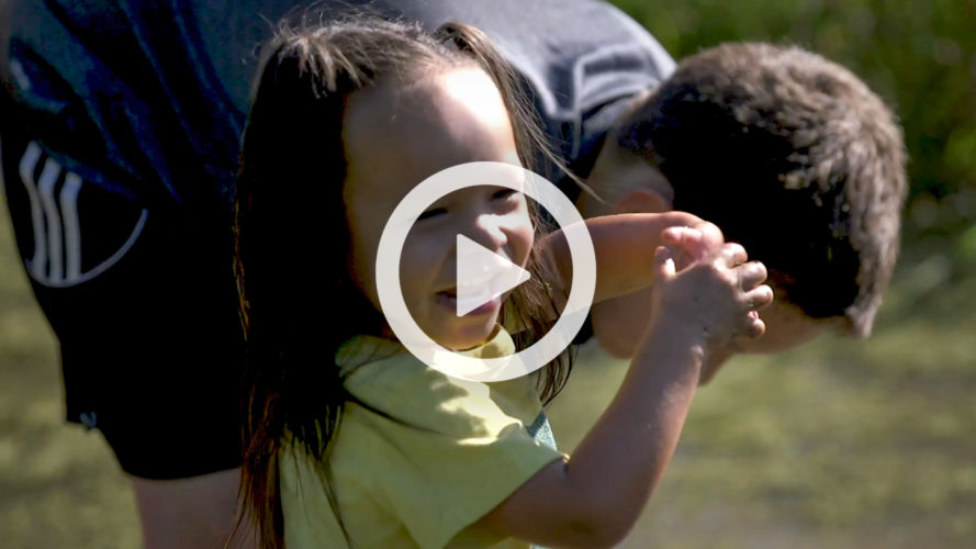 Video thumbnail of a smiling child in a wetland.