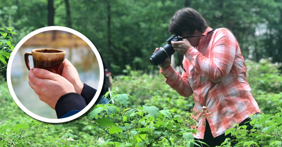 A person photographs plants in a wetland.