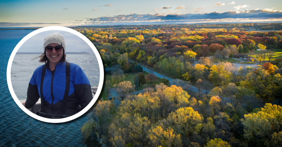 A drone image of the bay of Green Bay, with another image of presenter Emily Tyner wearing a hat and sunglasses with the lake behind her.